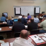 Selma, Ala., July 17, 2013 -- Emergency Management Institute instructors conduct a Table Top Exercise (TTX) with members of the Dallas County community in the Emergency Operations Center (EOC). The Dallas County EOC discussed a tornado event.
