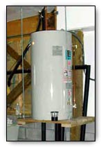 Water heater strapped to wall